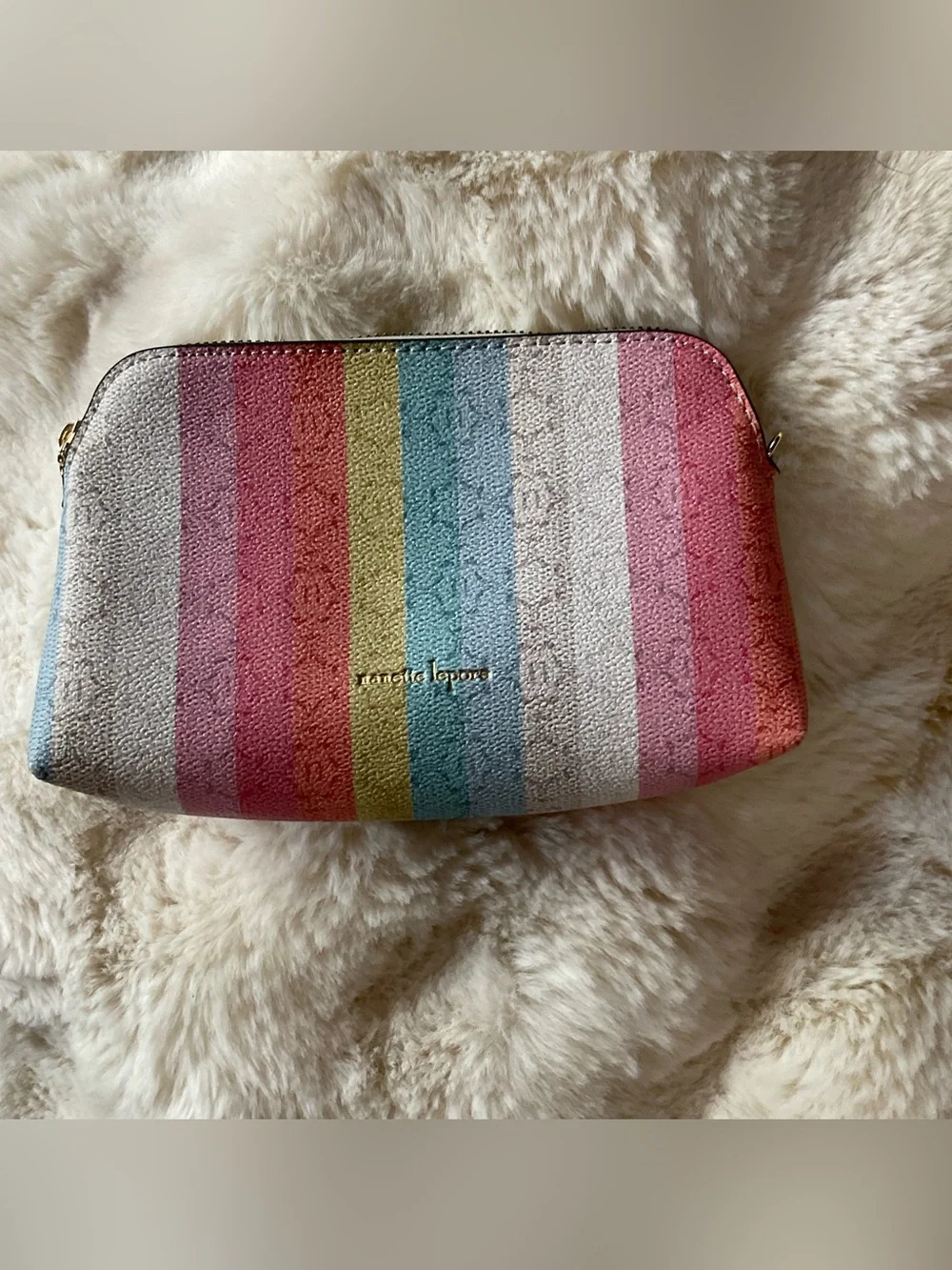 Nanette Lepore cosmetic bag w/ rainbow stripped pattern, zip closure, EUC